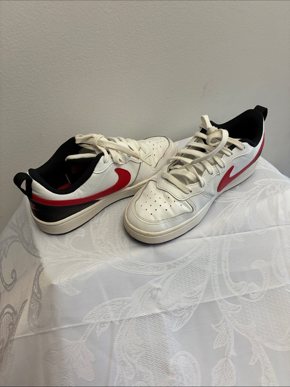 Nike Kids White Sneakers with Red Swoosh and Black Trim